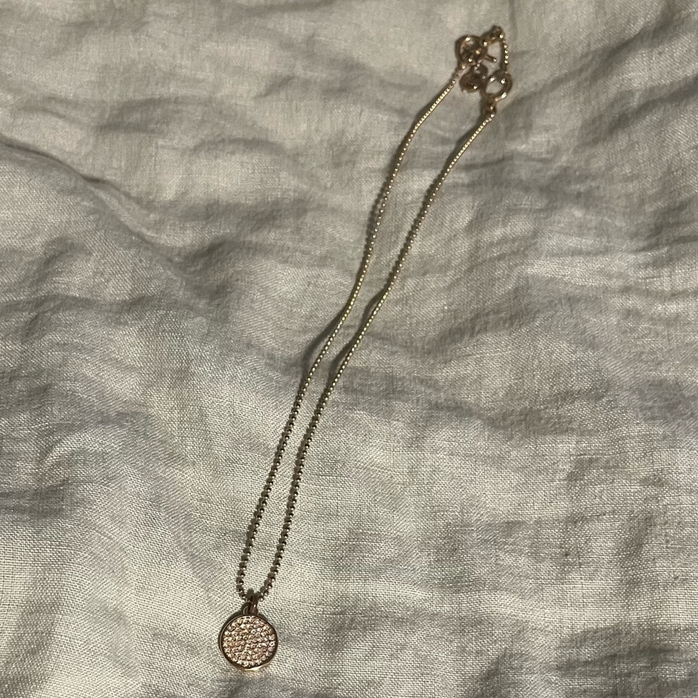 Michael Kors Gold Tone Round Pave Rhinestone Pendant